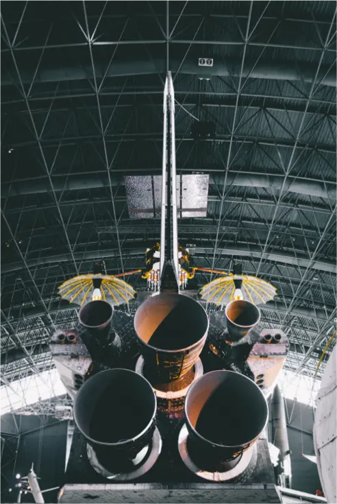 The rear of a rocket ship displaying the boosters
